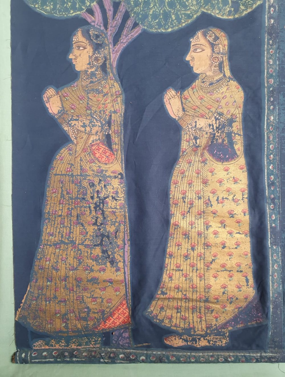 An Indian painted fabric hanging depicting two figures and a 1960's calendar, 31.5" x 24". (2) - Image 4 of 5