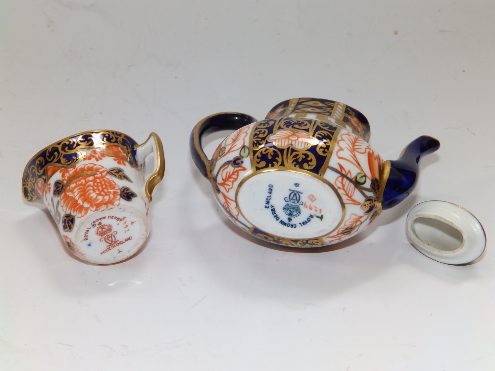 A miniature Royal Crown Derby Imari pattern coffee pot, 3" and a cream jug. (2) - Image 2 of 2