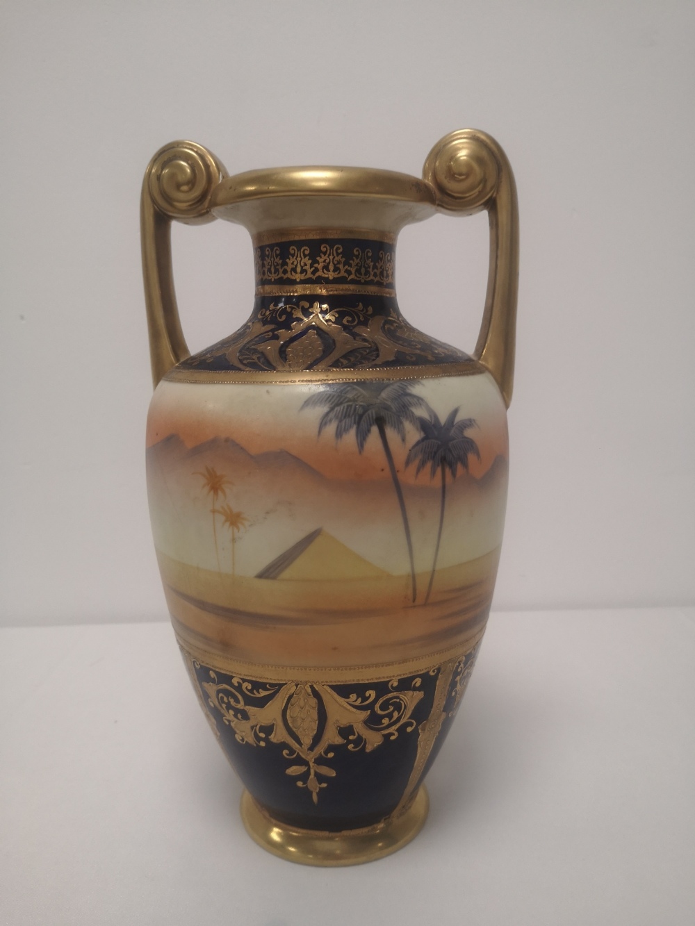 A Noritake vase painted with a camel in desert scene, 11" high. - Image 2 of 5