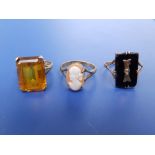 A citrine set 9ct ring and two others. (3)