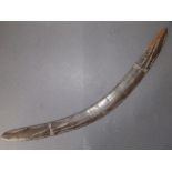 An antique boomerang with linear incised panel decoration, 22.75".