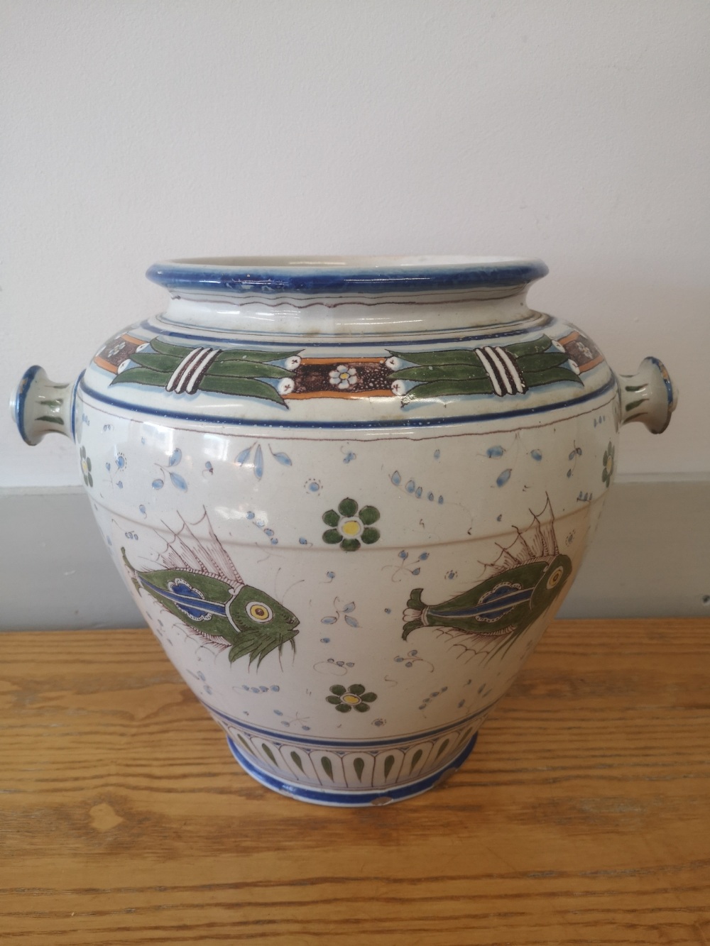 A Cantagalli maiolica two-handled jar decorated with fish in green and blue with small