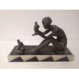 A French art deco metal figure study a seated flapper-girl with three doves, on black & white onyx