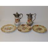 Two EP mounted Victorian Wiltshaw & Robinson Carlton Ware claret jugs and three pierced plates. (5)