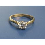 A diamond solitaire ring, the claw set brilliant weighing approximately 0.35 carat, in yellow 18ct &