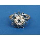 A sapphire & diamond set 18ct gold target cluster ring. Finger size P.