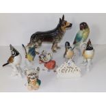 A Goebel porcelain alsatian, 7" high and seven various small animal figures. (8)