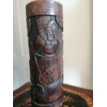 A large Japanese carved wooden brush pot decorated Samurai figures, 15" high.