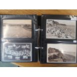 Two plastic folders containing old postcards showing Teignmouth, including Shaldon, many early 20thC