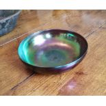 A Loetz style fruit bowl showing purple/green iridescence, 12" diameter.