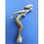 A plated female nude car mascot, 7" high.