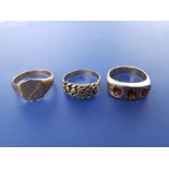 A 9ct ring set three red paste stones, a 9ct gold signet ring and one other. (3)