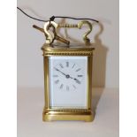 A French brass carriage clock by Richard & Co., 4.5" high excluding handle.