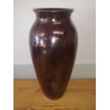 A large Moorcroft plain lustre vase of shouldered form in dark rust coloured glaze, impressed marks,
