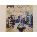 Oasis - 'Definitely Maybe' CD, the cover signed by the band members (first line-up).