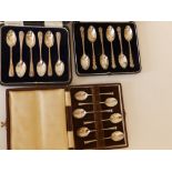 Three cased sets of silver coffee spoons. (18)