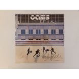 Oasis - signed 12" vinyl 45rpm 'Go Let It Out', signed in gold pen to cover by Noel & Liam