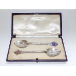A cased pair of Asprey silver '1937' Coronation spoons, one handle enamelled in blue for George