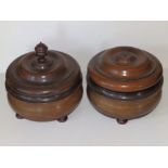 A pair of turned wooden caddies, 7.5" diameter. (2)