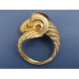 An 18ct gold ram's head ring by Lalounis, having a small rose cut diamond on top of the collar and