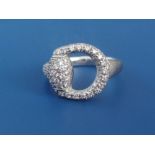 A Gucci pave set diamond 18ct white gold ring in the form of a horse bit. Finger size M.