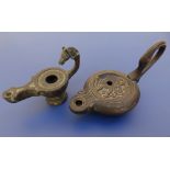 Two antique style bronze oil lamps, the larger 5" across handle.