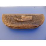 An African Kuba box, carved with a hand to the lid, 8.2" across.