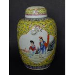 A Chinese porcelain yellow ground ginger jar with cover, having panel decoration with figures, 7.