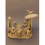 An Ashanti bronze figure group - Seated family members beneath small parasol, 5.75" high.
