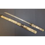 A 19thC Japanese sword with carved bone hilt & scabbard, 28.75" overall - a/f.