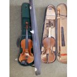 Two cased violins with bows, one a threequarter size with two piece back, the other a distressed