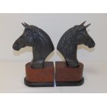 A pair of modern bronze horse head bookends, 12" high. (2)