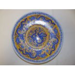 A late 20thC Chinese yellow ground porcelain dragon dish decorated in blue, 12" diameter.