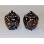 A small pair of Oriental cloisonne covered vases, the decoration on brown grounds, 3.8" high
