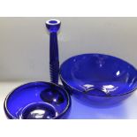 A Bristol blue glass bowl, 10" diameter, another, smaller and a 10" candlestick. (3)