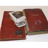 Two incomplete early 20thC postcard albums together with a quantity of mainly early 20thC