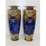 A pair of Royal Doulton stoneware vases decorated stylised flowers on central blue bands, 14" high.