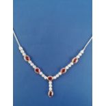 A modern ruby & diamond set necklace in 18ct white & yellow gold, comprising six oval cut rubies