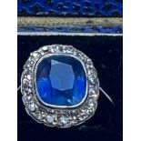 An early 20thC certified natural 3.29 carat Sri-Lankan sapphire & diamond cluster ring on platinum