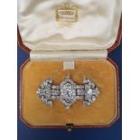 An Art Deco diamond brooch in fitted Cartier box, the brooch unsigned but probably by Cartier, of