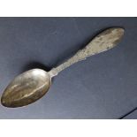 A Victorian silver presentation spoon, the flat handle engraved with military musical trophies,