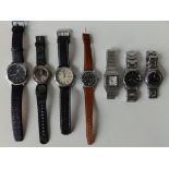 A modern Swiss Military Hanowa bracelet wrist watch, a Swatch Irony watch and five others. (7)