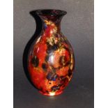 A Royal Doulton flambe vase, exhibiting a range of mottled coloured glazes - 'MG', 6.5" high.