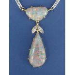 An Edwardian black opal & diamond set pendant necklace, the pear-shaped opal drop measuring 18 x 9.