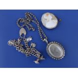 A Victorian white metal locket on chain, a charm bracelet and a (cracked) cameo. (3)