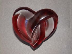 A boxed Lalique red sating glass 'Coeur Entrelaces' heart paperweight, etched signature 'Lalique,