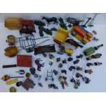 A collection of Britains and other lead farmyard animals and accessories.