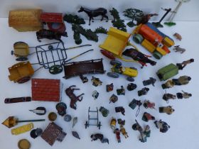 A collection of Britains and other lead farmyard animals and accessories.