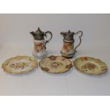 Two EP mounted Victorian Wiltshaw & Robinson Carlton Ware claret jugs and three pierced plates. (5)