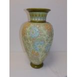 A Burmantofts 'Faience' vase, the tube-lined decoration depicting pale blue flowers with leafy stems